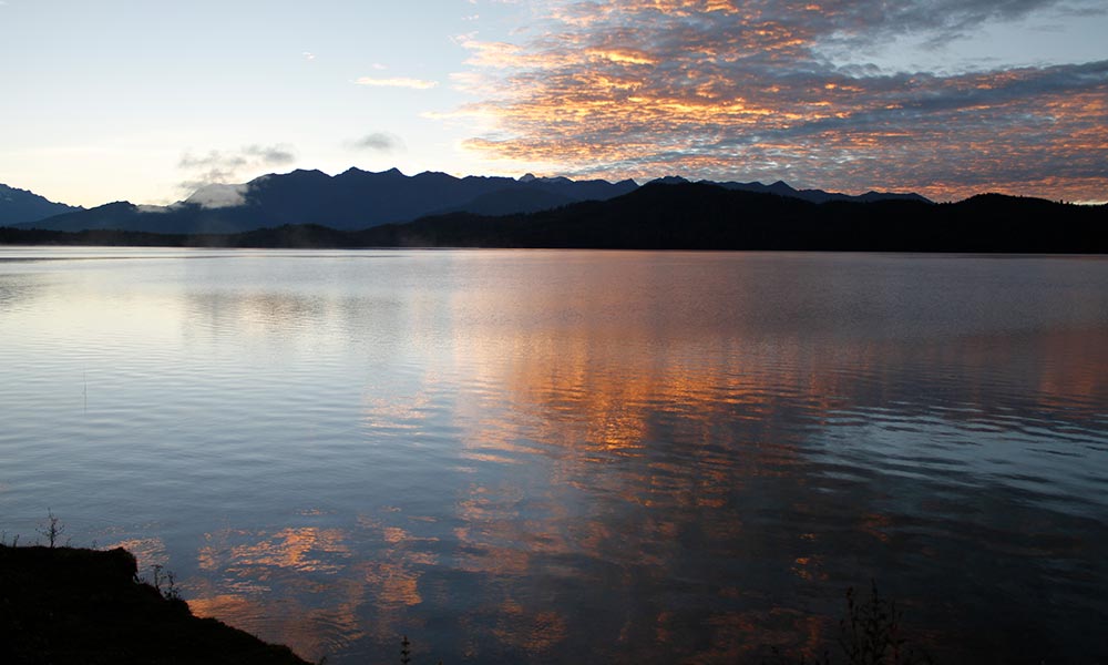 Reflection of clouds on Rara Lake during Sunset